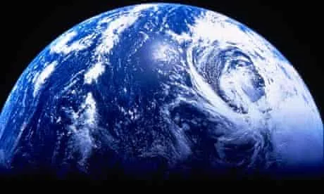 The Earth seen from space, half in shadow.
